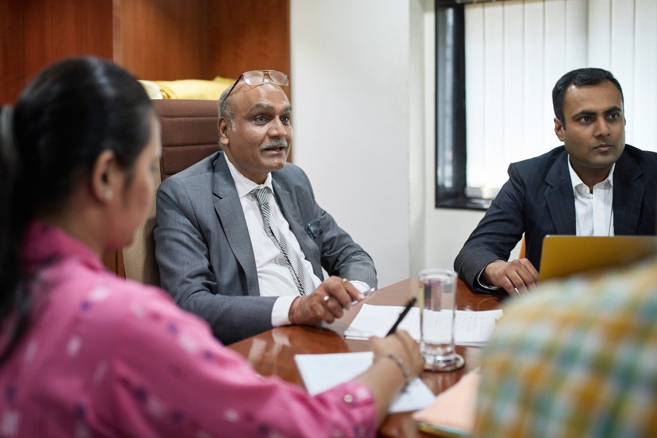 South Asian senior man at meeting