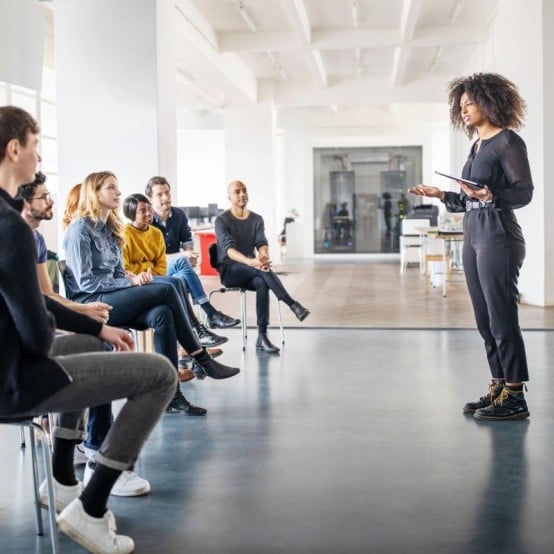 Woman giving presentation to audience